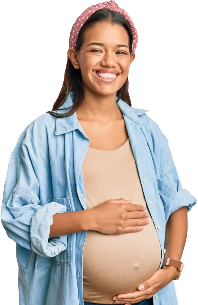 Beautiful hispanic woman expecting a baby, touching pregnant belly smiling